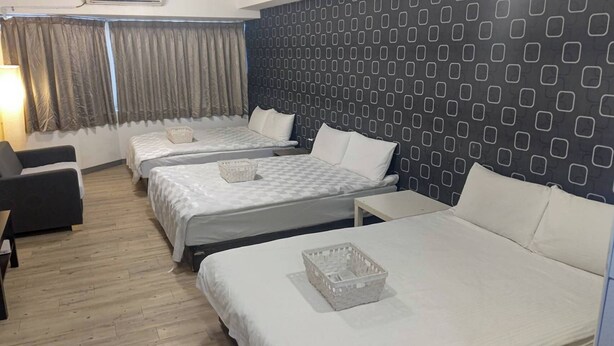 A hotel room with three beds, a desk, and a chair. - Sleep Taipei Hotel Nan-Ya Branch (New Taipei City)