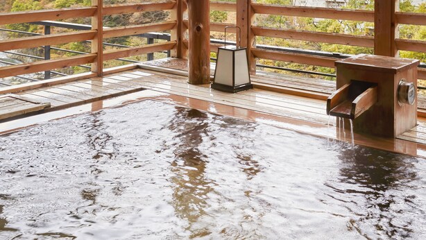 A wooden deck with a view of mountains and power lines. - Kinugawa Onsen Sanraku (Nikko)