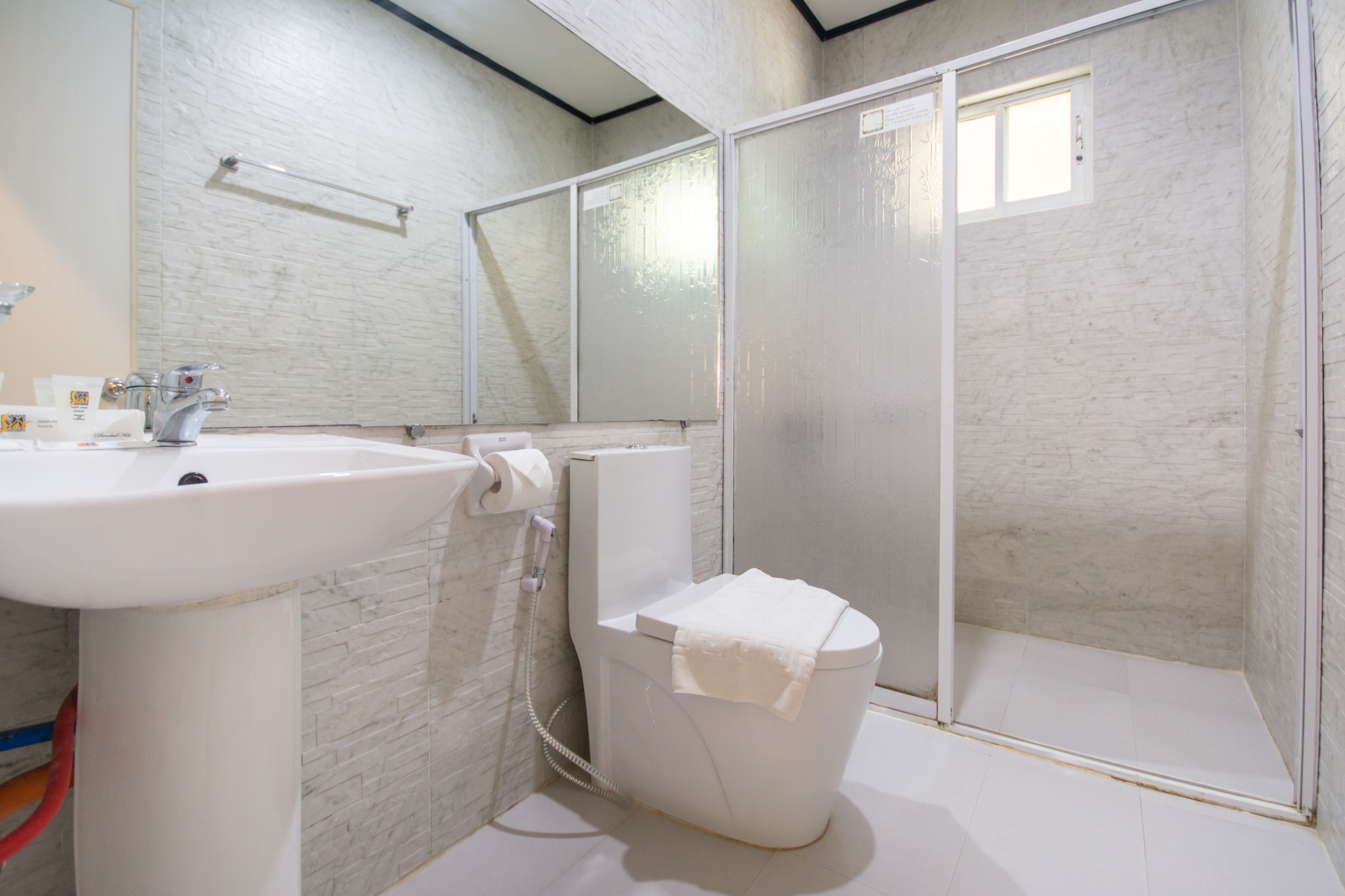 standard triple room | bathroom | shower, bidet, towels