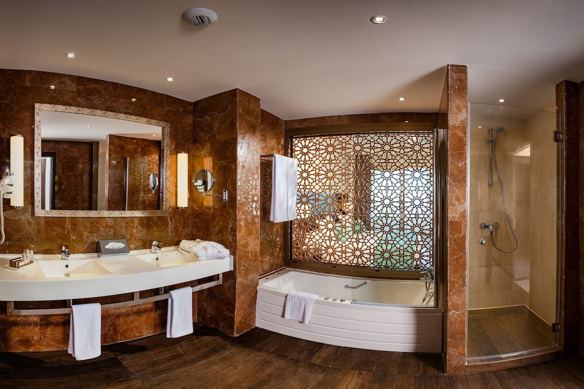 combined shower/bathtub, free toiletries, hair dryer, bathrobes