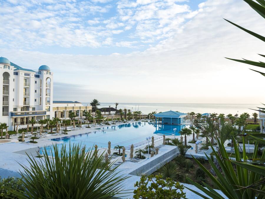 Indoor pool, outdoor pool, pool umbrellas, pool loungers