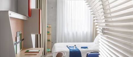 Premium bedding, down duvets, in-room safe, desk