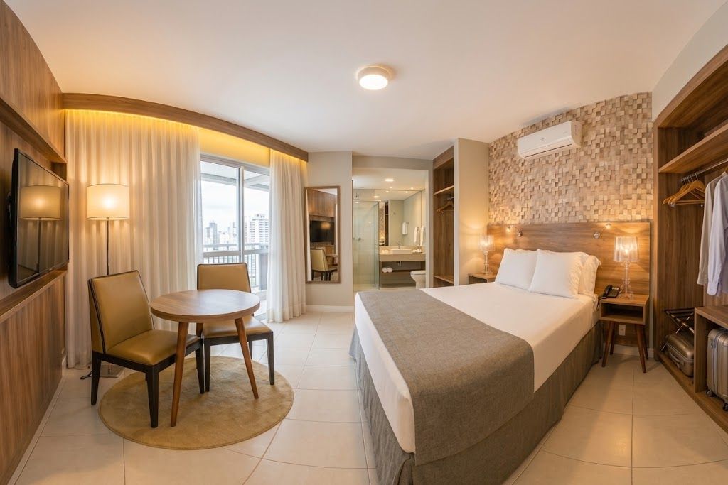 Deluxe Double Room, 1 Double Bed, Patio, City View | Minibar, in-room safe, desk, blackout drapes