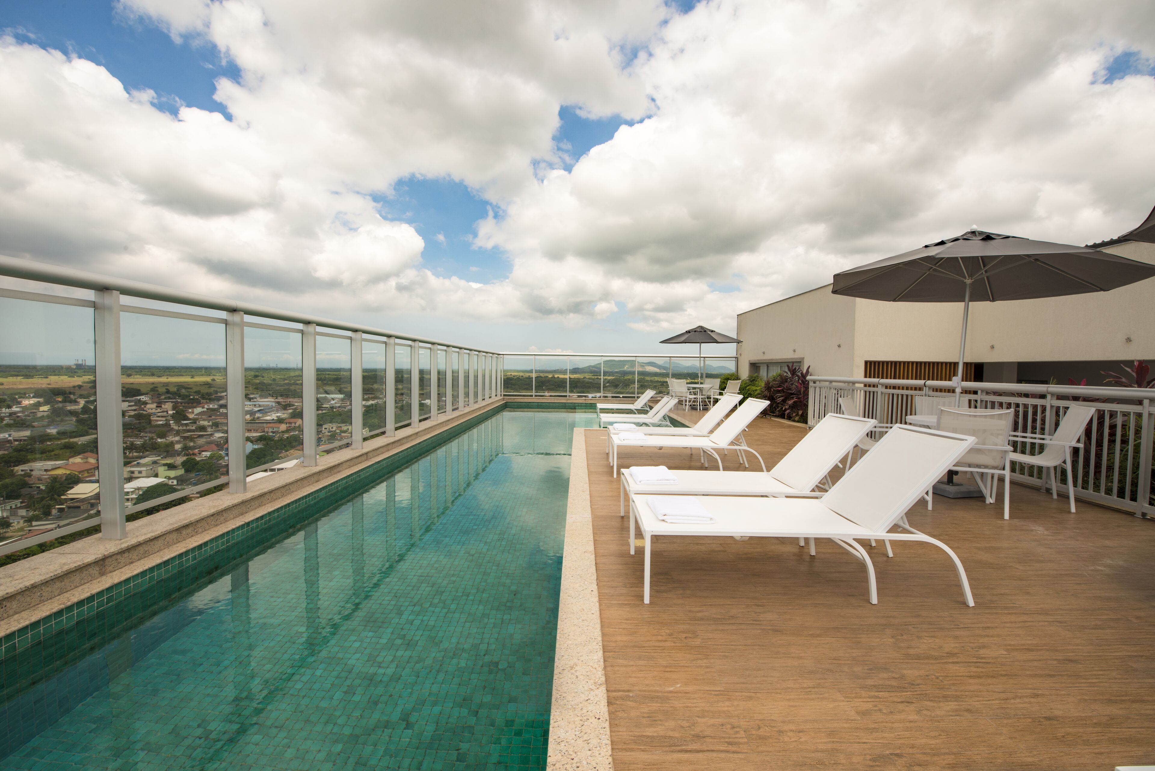 outdoor pool, open 10:00 am to 6:00 pm, pool umbrellas, pool loungers