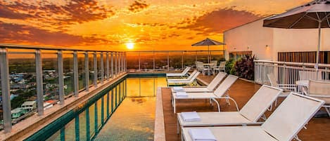 Outdoor pool, open 8:00 AM to 8:00 PM, pool umbrellas, pool loungers