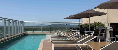 Outdoor pool, open 8:00 AM to 8:00 PM, pool umbrellas, sun loungers