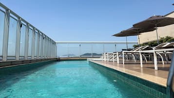 Outdoor pool, open 10:00 AM to 6:00 PM, pool umbrellas, sun loungers