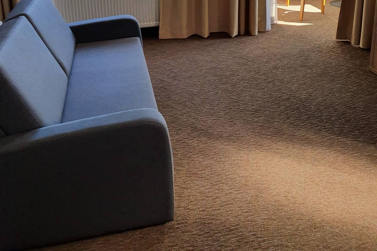 junior studio suite, 1 queen bed, non smoking, sea view | living area | tablet