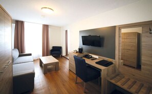 Superior Double Room | Living area | Flat-screen TV