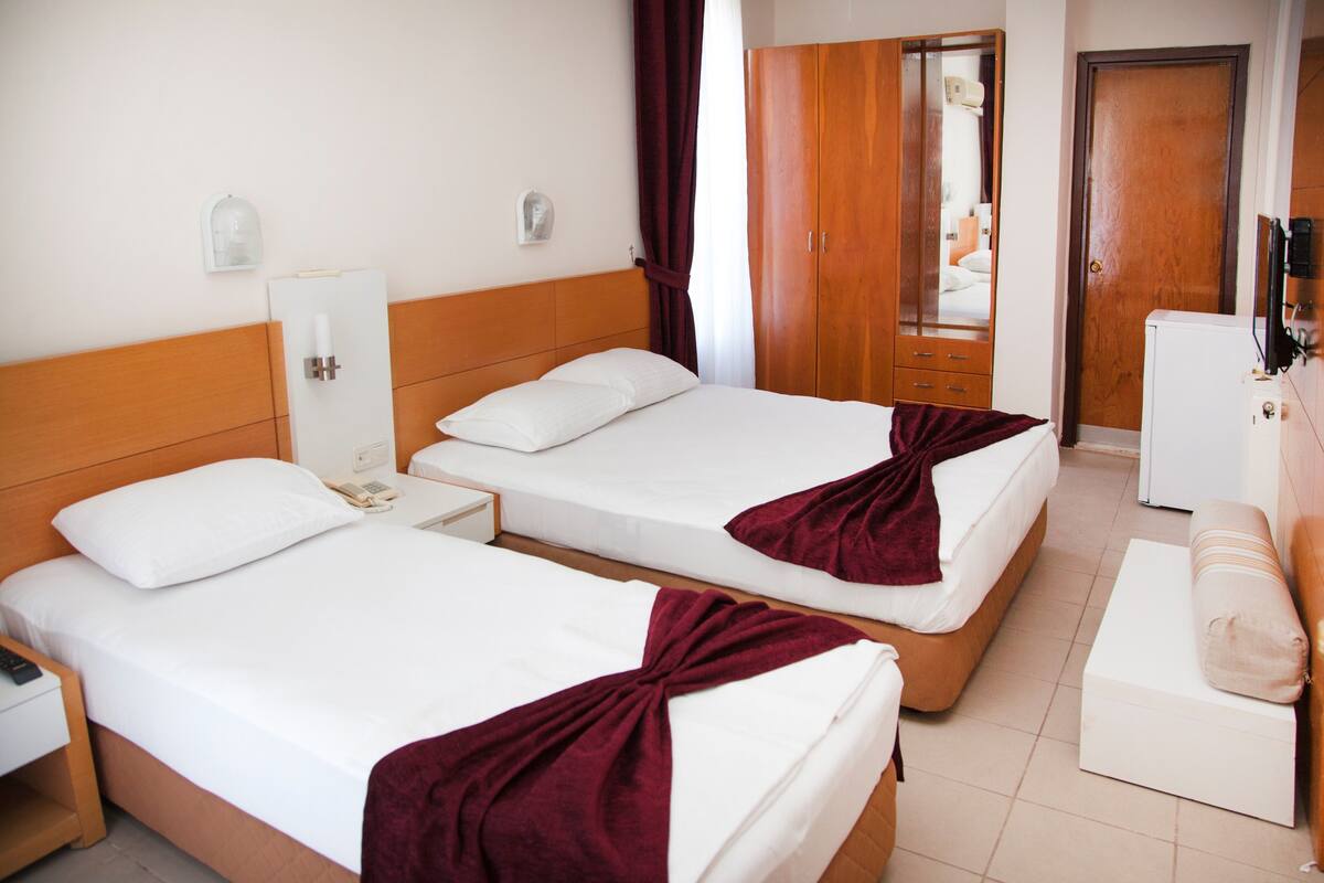Triple Room, Sea View | Minibar, desk, soundproofing, free cots/infant beds