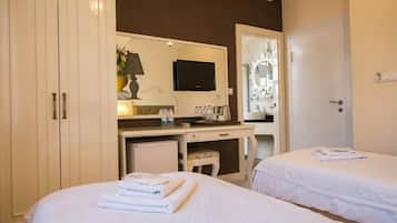 Luxe beddengoed, een minibar, een kluis op de kamer, een bureau