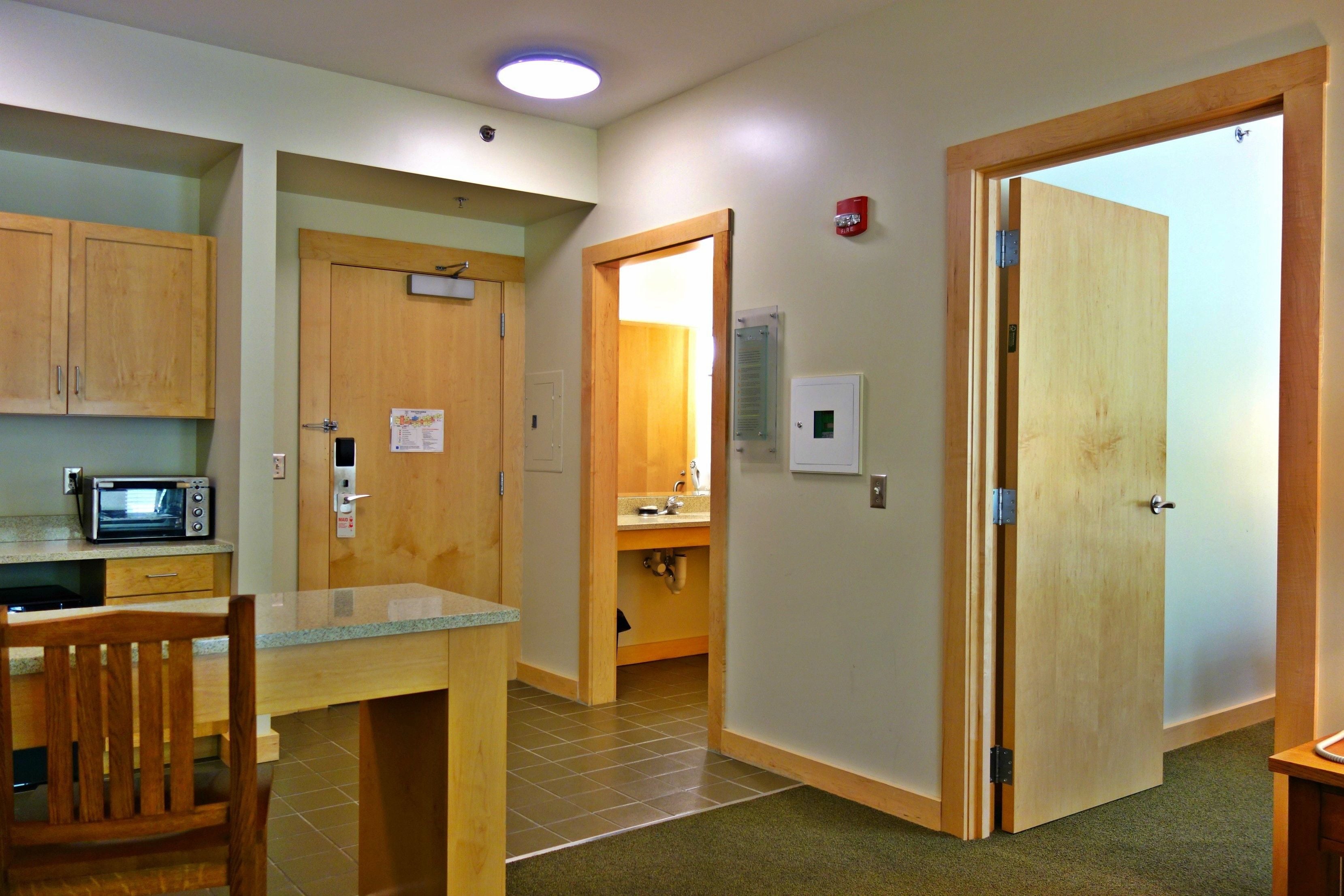 family suite, 2 bedrooms, kitchenette, mountainside | laptop workspace, iron/ironing board, free cots/infant beds