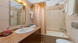 Separate bathtub and shower, free toiletries, hair dryer, bathrobes