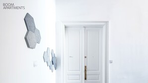 A white door with a handle and a sign reading "BOOM APARTMENTS". - Boom Apartments (Kraków)