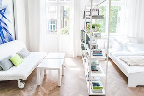 Standard Apartment, Balcony | Living room | Flat-screen TV