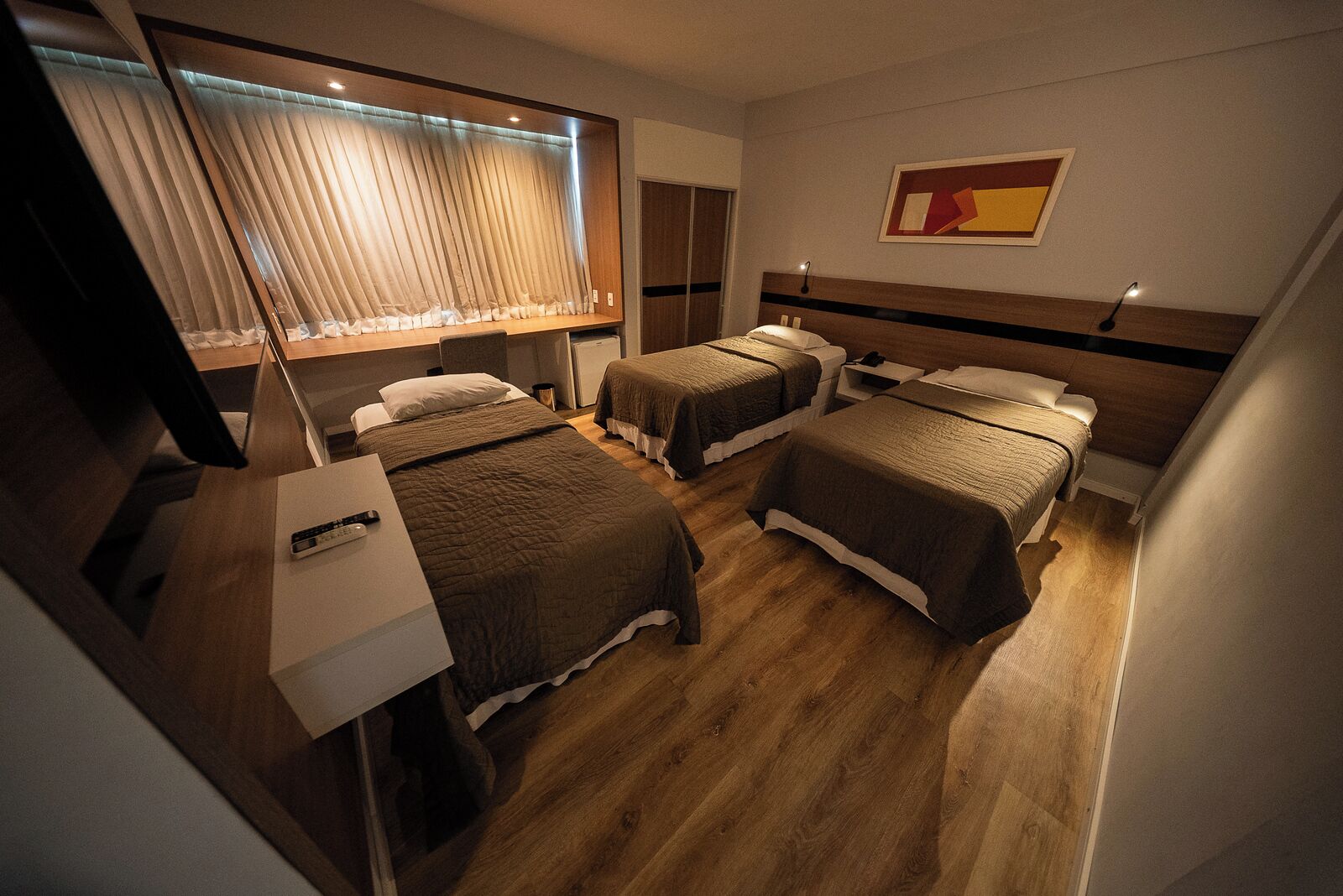 Deluxe Triple Room | Minibar, individually furnished, desk, laptop workspace