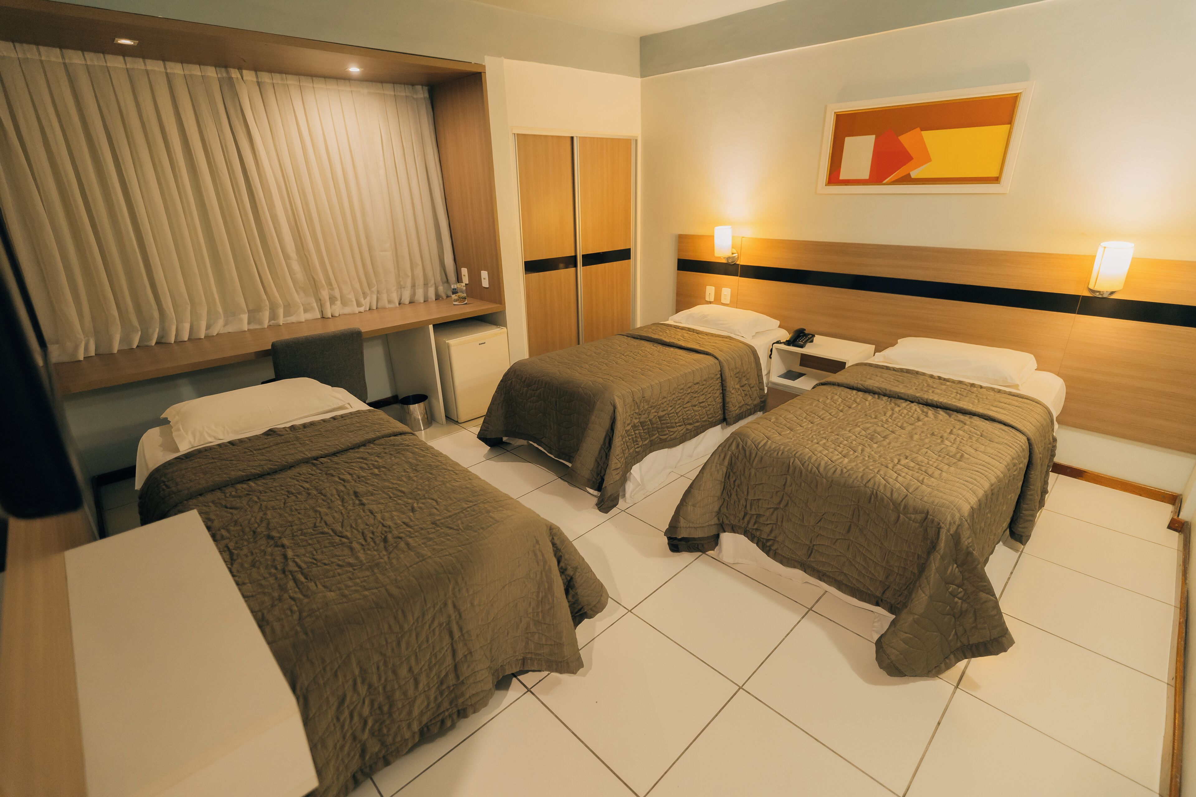 deluxe triple room | minibar, individually furnished, desk, laptop workspace