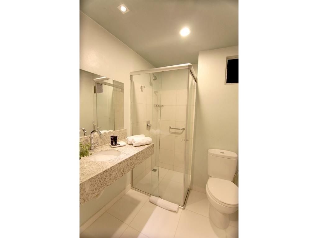 shower, designer toiletries, hair dryer, towels