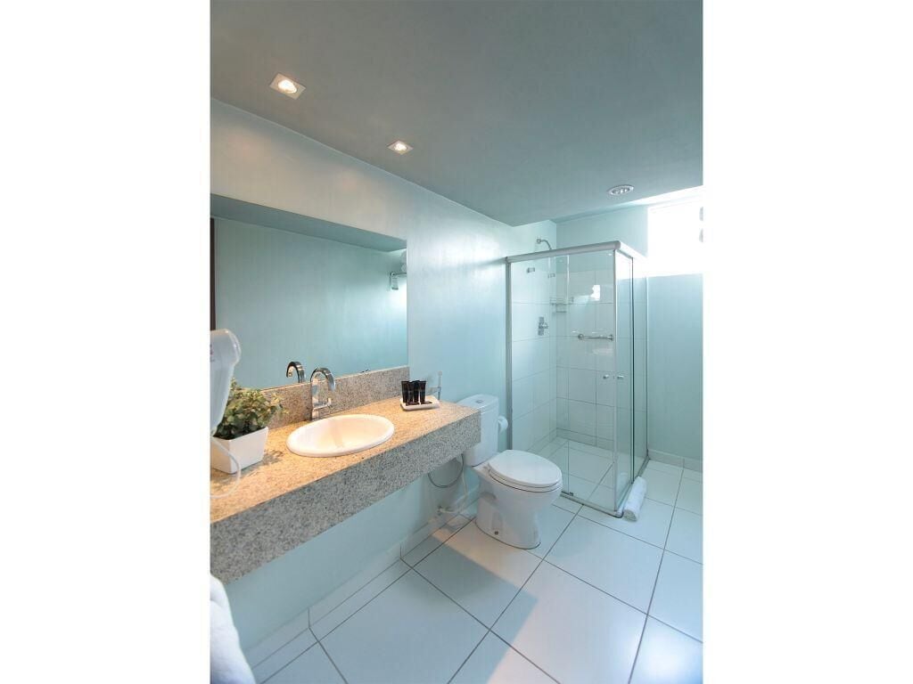 shower, designer toiletries, hair dryer, towels