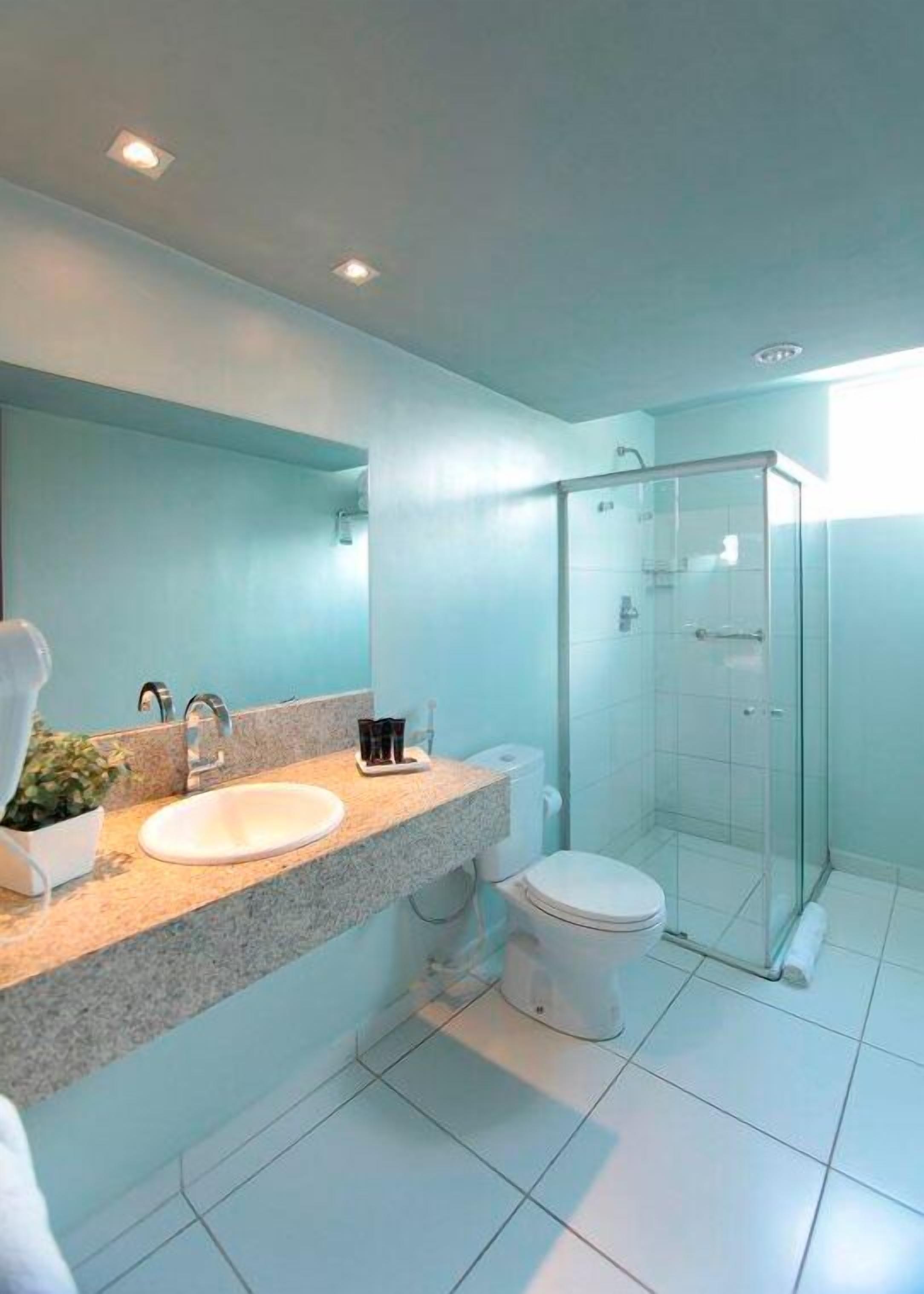 shower, designer toiletries, hair dryer, towels