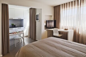 Studio | Down comforters, blackout drapes, iron/ironing board