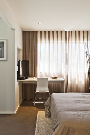 Studio | Down comforters, blackout drapes, iron/ironing board