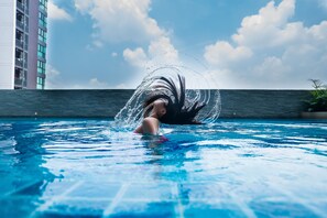 Outdoor pool, open 7:00 AM to 10:00 PM, pool loungers