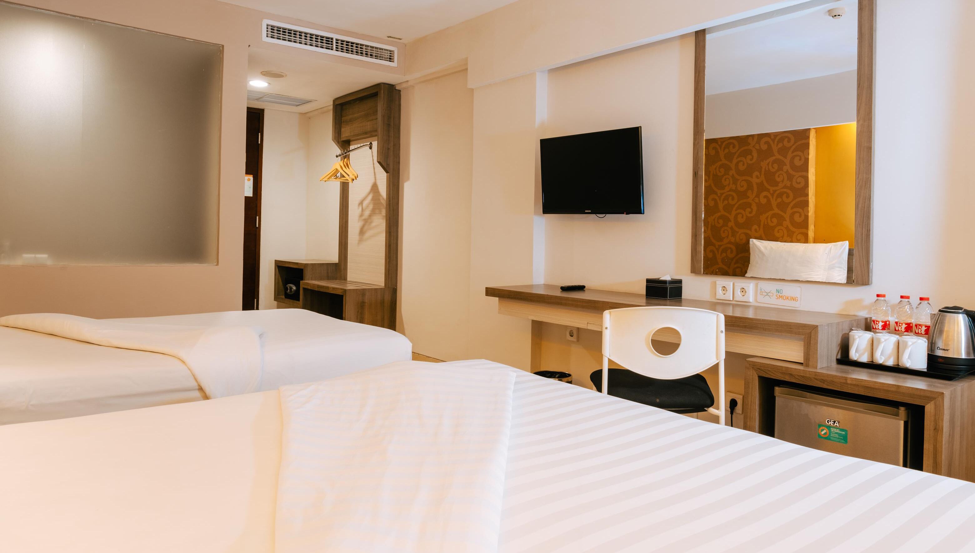 family room | 1 bedroom, minibar, in-room safe, desk