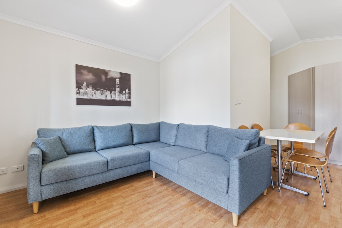 Two Bedroom Deluxe Cabin | Living area | Flat-screen TV
