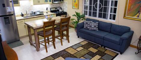 Luxury Townhome, 1 King Bed, City View, Executive Level | Living room | 50-inch flat-screen TV with cable channels, TV, DVD player