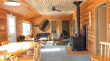 Standard Cabin, 4 Bedrooms, River View | Living room | Fireplace