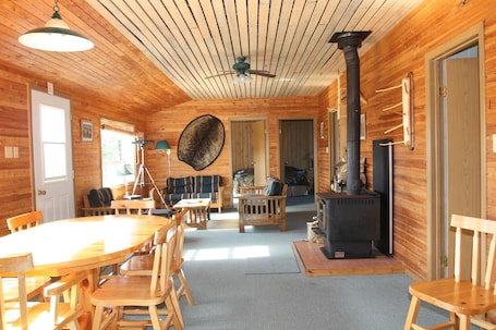 Standard Cabin, 4 Bedrooms, River View | Living room | Fireplace. Kaska Goose Lodge
