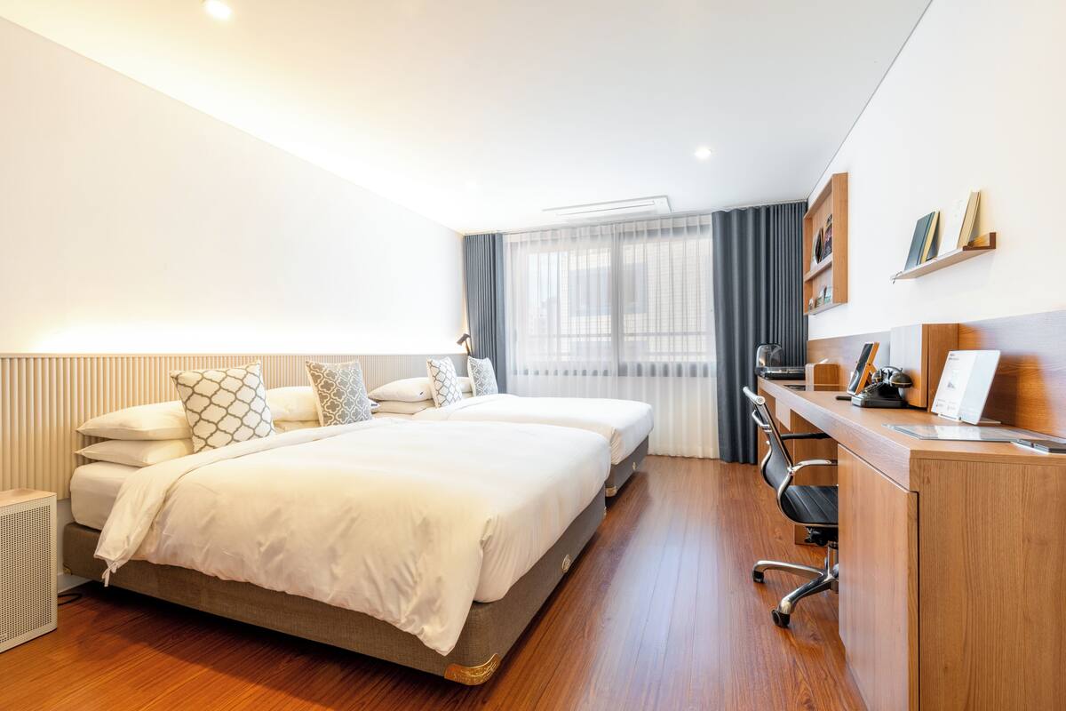 [City View] Family Suite, 1 Bedroom (2 Double Beds), 1 Living Room, 2 Bathrooms | Roupas de cama premium