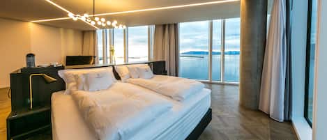 Luxury Suite (Large Corner) | Living area | 50-inch flat-screen TV with satellite channels, TV, iPad