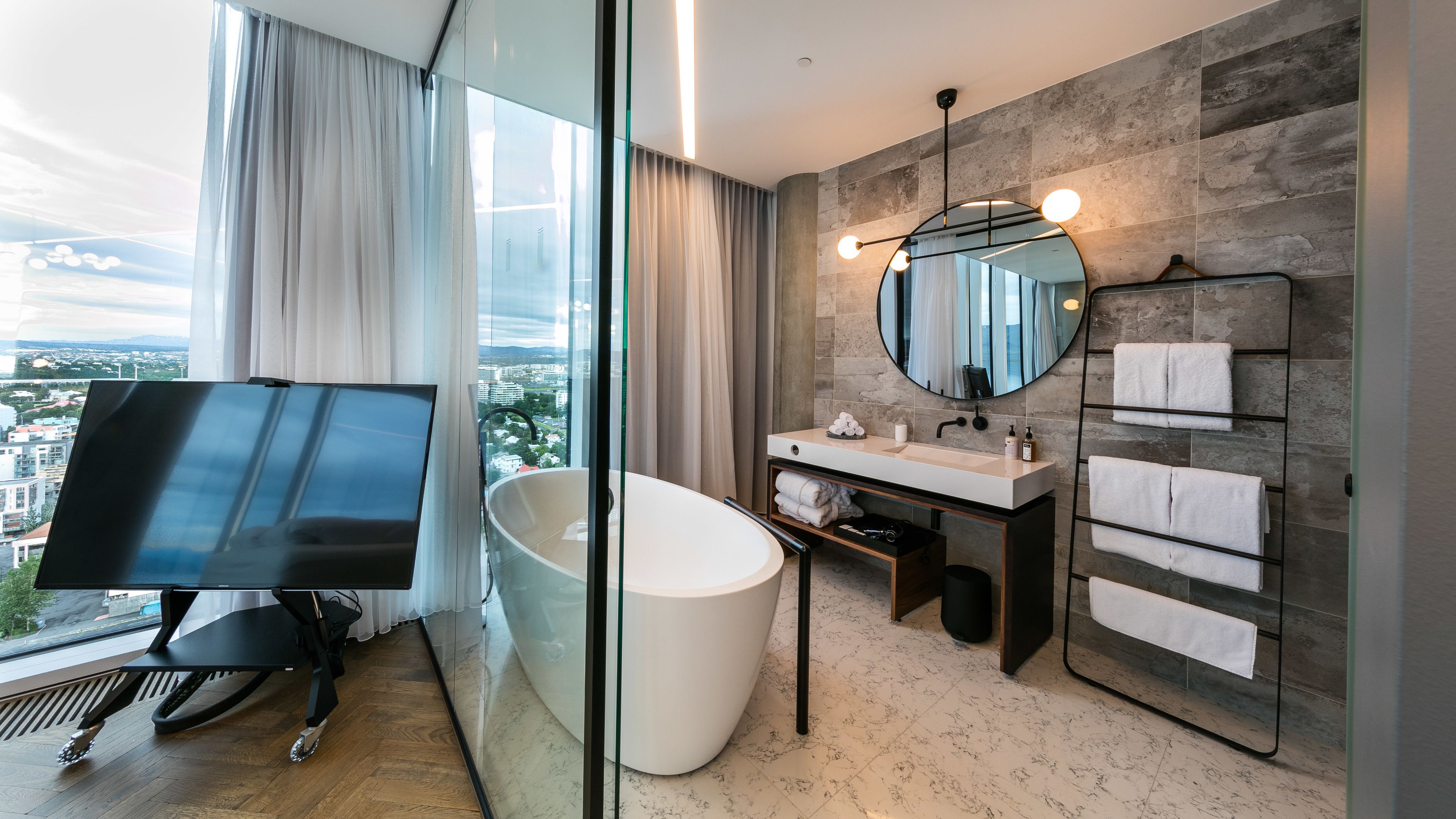 designer toiletries, hair dryer, bathrobes, slippers