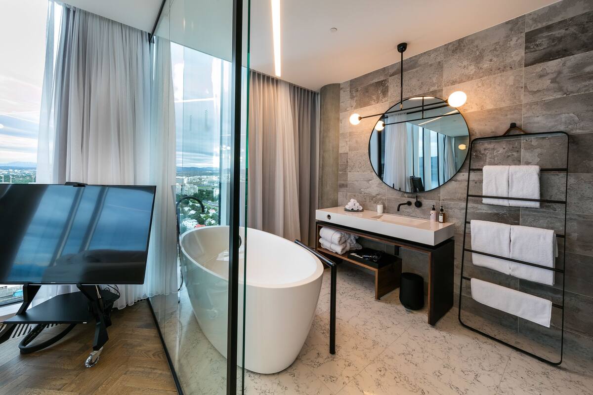 designer toiletries, hair dryer, bathrobes, slippers