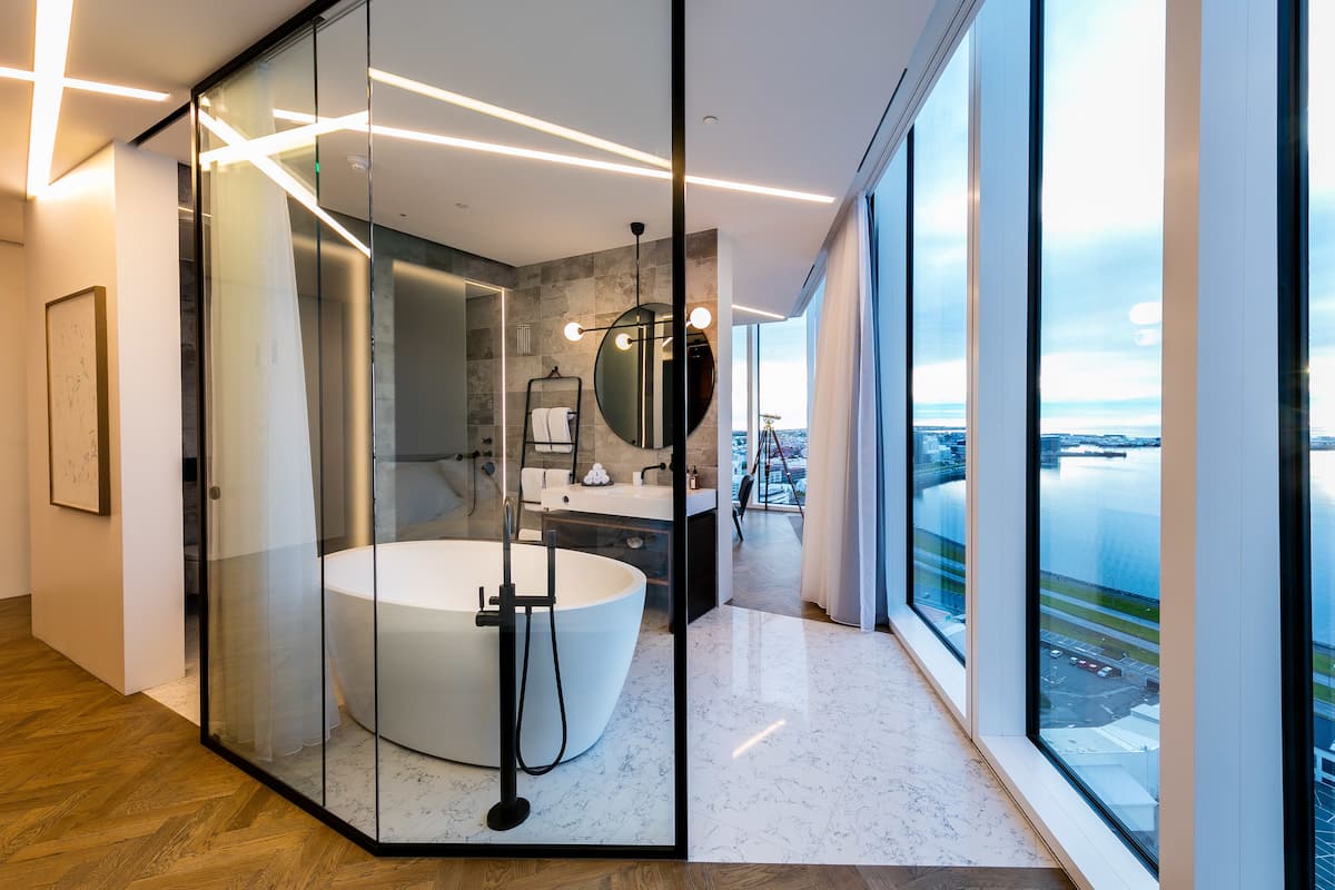 designer toiletries, hair dryer, bathrobes, slippers