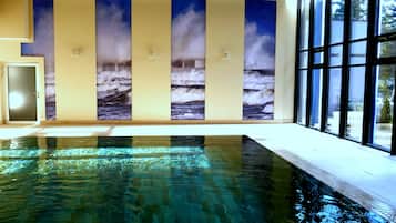 Indoor pool, open 8:00 AM to 7:00 PM, pool loungers