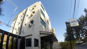 A modern building with a sign for 'MozaiKa Guest House'. - Mozaika Guesthouse 2 (Maputo)