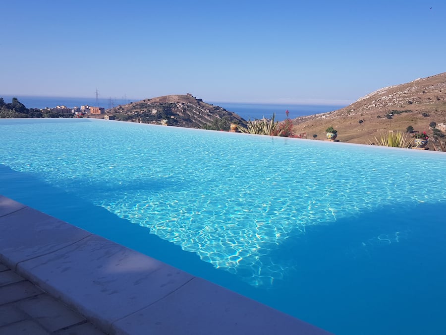Seasonal outdoor pool, pool umbrellas, pool loungers