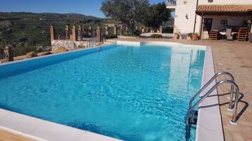 Seasonal outdoor pool, pool umbrellas, sun loungers