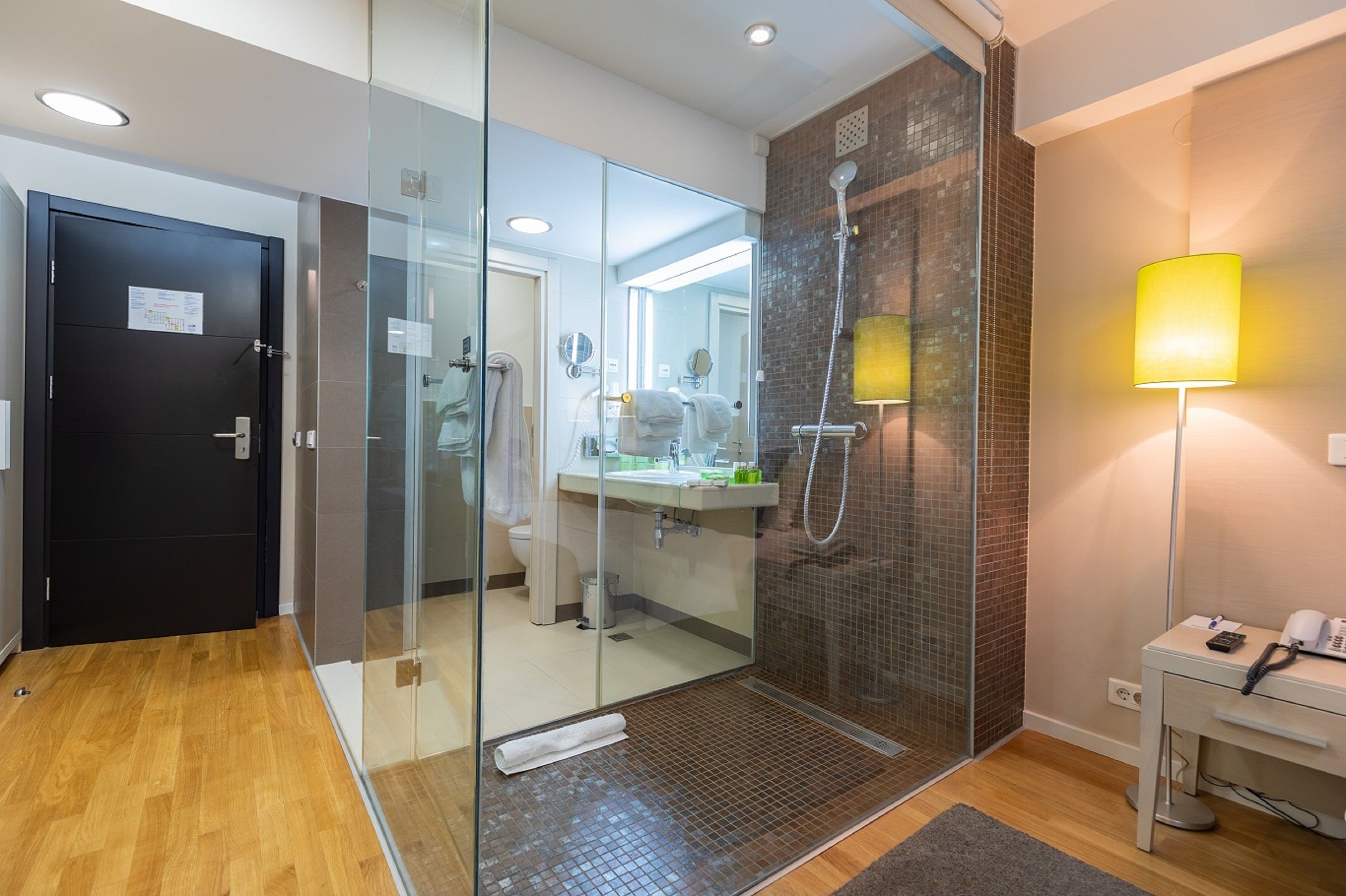 premier room, 1 king bed | bathroom | free toiletries, hair dryer, towels