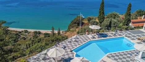 Outdoor pool, pool umbrellas, pool loungers