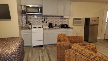 Basic Studio Suite | Desk, blackout drapes, iron/ironing board, rollaway beds