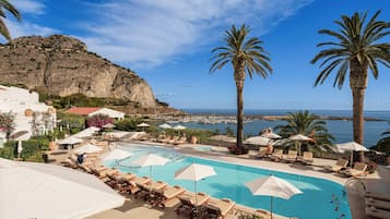 Seasonal outdoor pool, open 8:00 AM to 7:00 PM, pool umbrellas