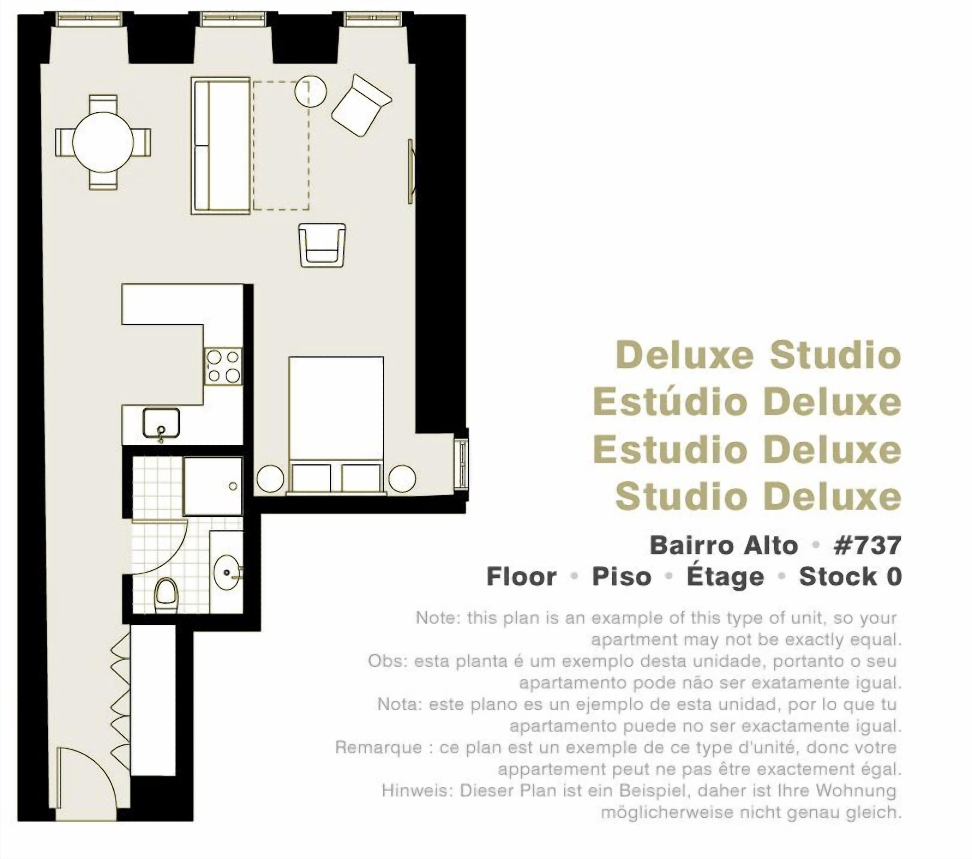A floor plan of a Deluxe Studio apartment with a kitchenette, a dining area, a living room, and a bathroom.