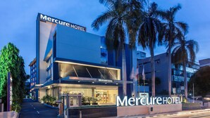 A modern hotel building with a prominent sign reading "Mercure Hotel". - Mercure Jakarta Cikini (Jakarta)