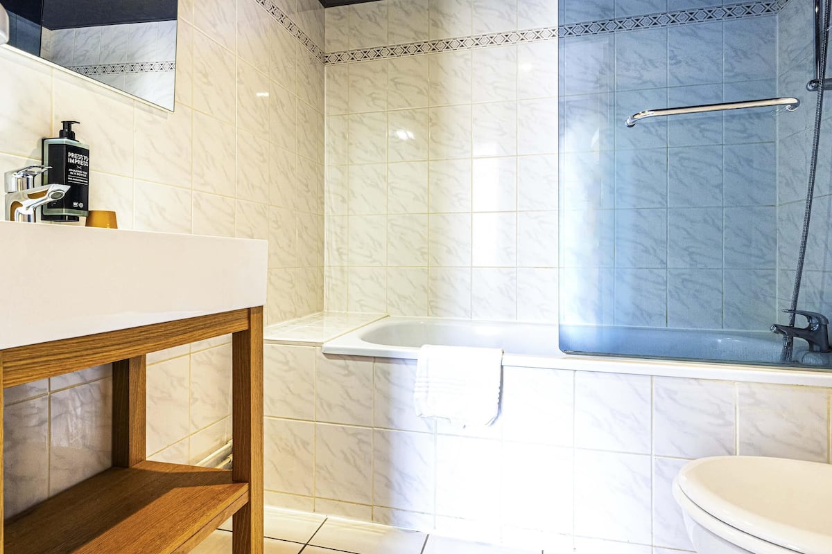 premium bedding, desk, laptop workspace, blackout curtains