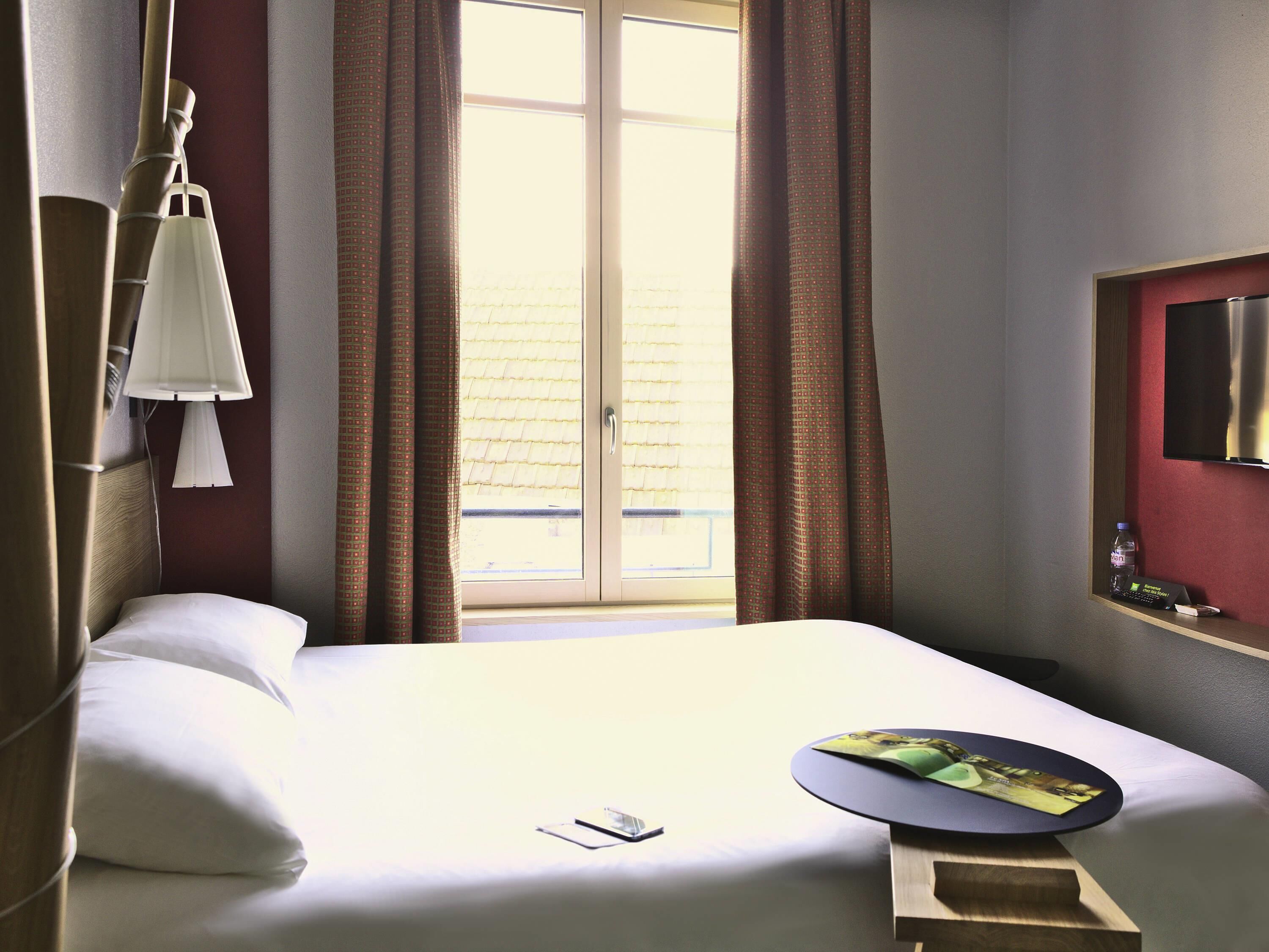 Premium bedding, desk, laptop workspace, blackout curtains