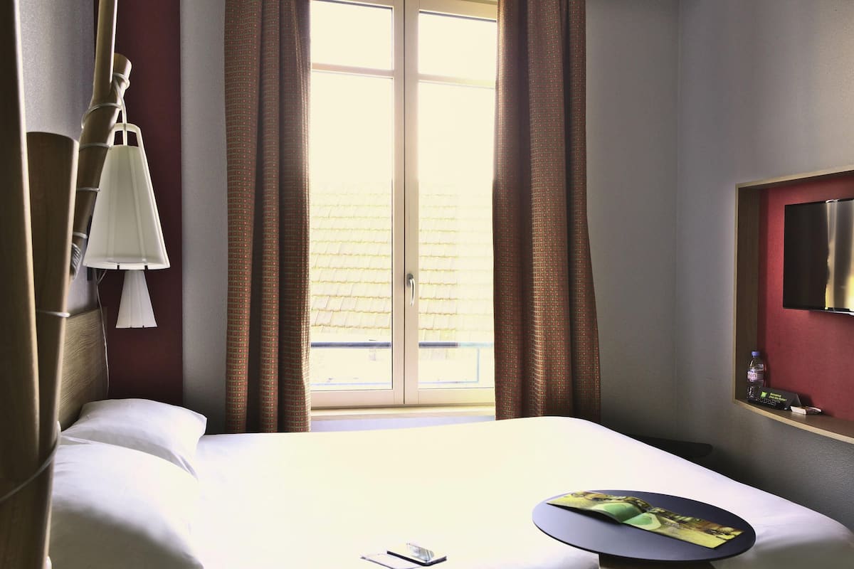 Premium bedding, desk, laptop workspace, blackout curtains